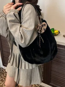 Autumn winter black plush shoulder bag with leopard heart charm, stylish commuter fluffy handbag.
