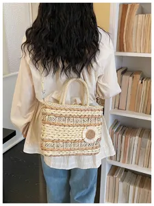 Woven straw basket bag for women, large capacity beach handbag with sunflower detail.