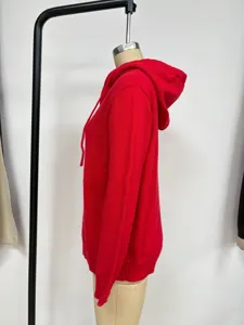 Side view of a red knitted hoodie sweater with drawstring hood and long sleeves for women.