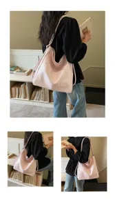Detailed view of the pink soft leather large capacity shoulder bag, showcasing premium texture and design.