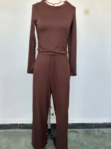 Solid color casual long-sleeve top and high-waist wide-leg pants set detail view in rich brown color.