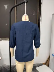 Back detail view of the solid color casual 3/4 sleeve linen cotton blouse for women.