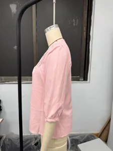 Pink linen blouse side detail view, elegant square neck with lace trim, summer casual top.