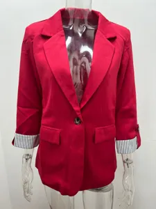 Close-up detail of women red casual blazer jacket featuring 3/4 rolled striped sleeves.