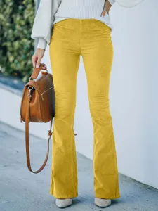 Detailed view of women high waist corduroy flare pants casual trousers in bright yellow.