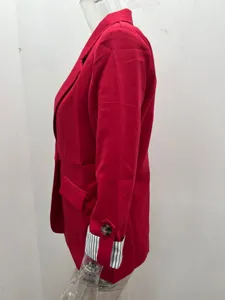 Red women's casual blazer detail showing striped rolled-up cuffs and fitted silhouette.