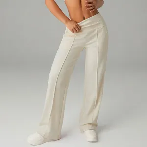 Pantalone casual a vita alta incrociata con gamba larga e pieghe centrali per donna.