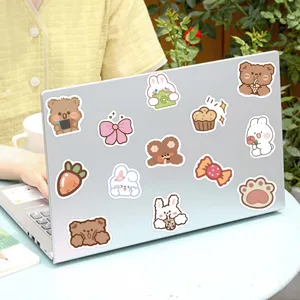 Cute cartoon stickers detail shot featuring lovely bears and rabbits for laptop DIY decoration.