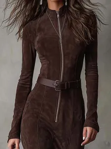 Detailed close-up of the stylish brown suede long-sleeve jumpsuit featuring a chic front zipper.