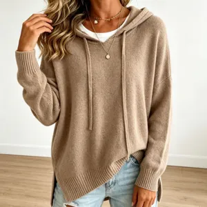 Close-up detail of women's khaki knit hoodie sweater, featuring long sleeves and drawstrings.