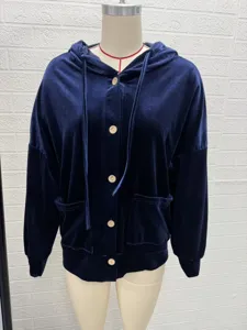 Close-up detail of the dark blue velvet hooded cardigan, featuring front button closure.