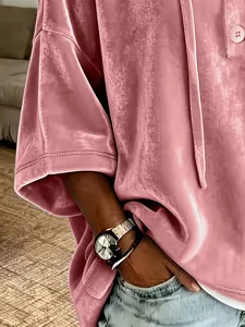 Pink velvet short sleeve top detail shot, soft fabric texture and casual fit garment view.