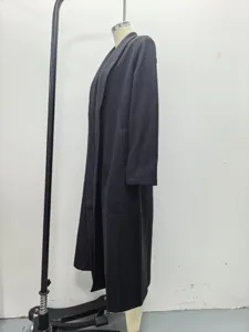 Black extra long woolen trench coat detail, casual oversized lapel winter outerwear.