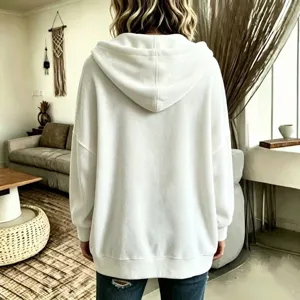 Detail view of the comfortable solid color velour hooded cardigan jacket in soft white style.