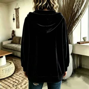 Detailed view of women's black velvet hooded cardigan jacket, soft texture and casual fit.