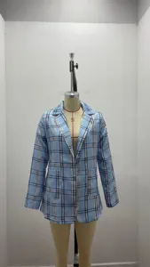 Close-up detail of women blue plaid blazer featuring classic lapel collar and pocket.