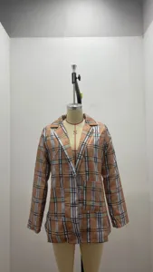 Detailed view of women casual plaid blazer jacket, lapel collar, classic pattern, long sleeve.