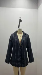 Detail view of women's black plaid blazer, casual lapel slim cardigan jacket for spring autumn.
