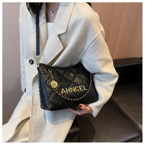 Black quilted shoulder bag with chain strap and metallic letters, perfect daily chic style accessory.