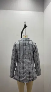 Back view detail showing womens black and white plaid slim fit suit blazer jacket.