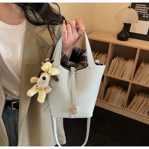Leather bucket bag for women with cute doll pendant stylish shoulder bag daily commute purse