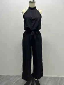 Details of the black halter neck sleeveless wide leg jumpsuit with waist tie for women.