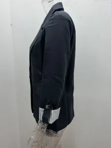 Detailed side view of women black casual blazer with stylish striped rolled cuffs and button.