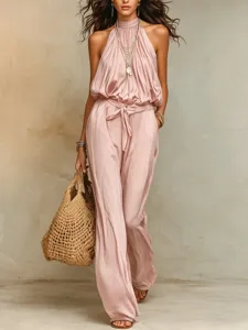 Bohemian halter sleeveless jumpsuit featuring a self-tie waist and wide-leg design.