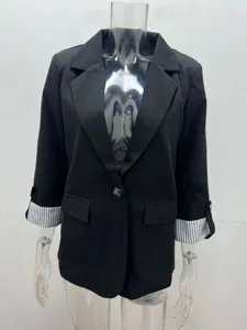 Black casual blazer detail view, slim fit jacket with stylish striped rolled sleeves.