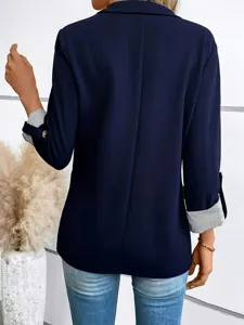 Back view detail of navy blue women's casual blazer jacket showing striped rolled cuffs.
