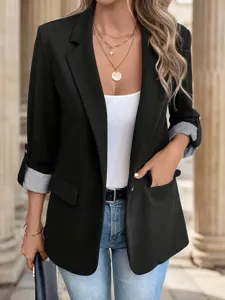 Women black blazer detail showing 3/4 rolled sleeves with striped lining and lapel collar.