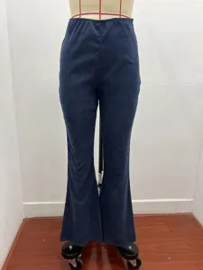 Detail view of women's solid color corduroy flare pants featuring elastic waist and high rise fit.