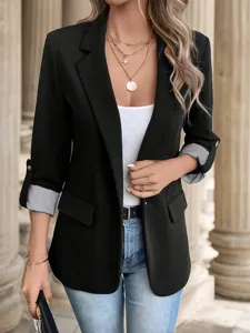 Close-up detail of womens casual black blazer jacket featuring stylish rolled sleeves and slim fit.