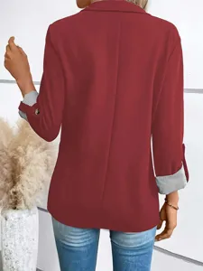 Close-up view of the wine red blazer back, featuring rolled striped cuffs and lapel design.