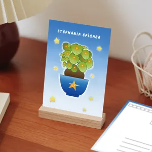 Cartoon plant postcard creative greeting card with wooden stand for birthday party decor.