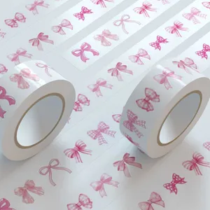Roze strik decoratieve washi tape en stickerrol voor DIY dagboek en mobiele telefoon decoratie.