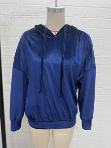 Detailed view of a solid color velvet hooded sweatshirt for women, long sleeve, cozy winter style.