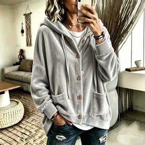 Detail view of women casual velvet hooded cardigan in solid gray with front buttons and pockets.