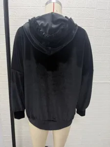 Back view detail of women's black velvet hoodie sweatshirt featuring long sleeves and cozy fabric.