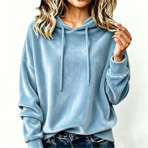 Close-up detail of women's velvet hoodie with adjustable drawstring and long sleeves.