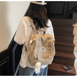 Casual large capacity nylon backpack for women, lightweight versatile travel school bag.