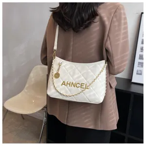 Stylish white quilted chain shoulder bag for women, elegant PU leather crossbody handbag.