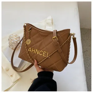 Stylish brown quilted chain shoulder bag for women, elegant leather crossbody bucket bag.