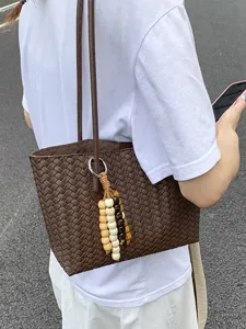 Classic brown woven leather tote bag for women, minimalist large capacity shoulder commuting bag.