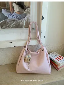 Sac cabas rose chic pour femme, grand sac a epaule decontracte pour les trajets quotidiens.