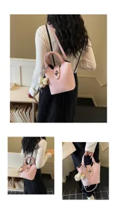 Detailed view of the pink leather bucket bag, chic handbag and shoulder bag for women.