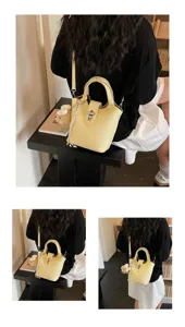 Yellow leather bucket bag for women, stylish crossbody shoulder handbag with cute bear.