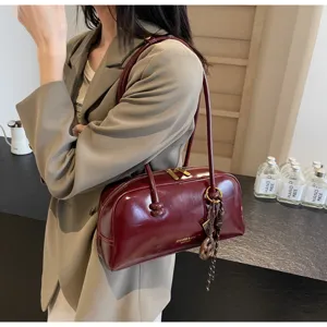 Vintage patent leather shoulder bag for women, chic autumn winter retro pillow handbag.