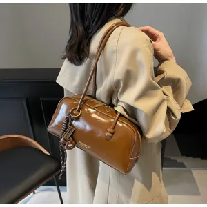 Brown patent leather shoulder pillow bag, casual retro autumn commute underarm handbag detail
