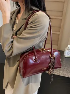 Retro patent leather shoulder bag for women, versatile chic pillow bag for daily commuting stylish.